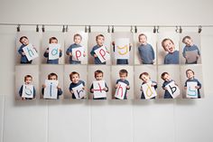 a group of photos hanging on a wall with clothes pins attached to it's sides