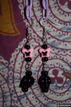 Handmade black and pink skull beaded earrings Black Emo Earrings For Gift, Edgy Black Beaded Jewelry, Black Pierced Emo Earrings, Pink Beaded Earrings With Black Beads For Gift, Pink Dangle Beaded Earrings With Black Beads, Edgy Adjustable Pink Jewelry, Adjustable Edgy Pink Jewelry, Black Skull Earrings For Gift, Nickel-free Black Emo Jewelry