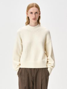 This cozy wool-blend turtleneck sweater features a semi-oversized silhouette perfect for versatile styling throughout the cold seasons. The premium fabric blend combines 70% acrylic with wool, nylon, and spandex for the ideal balance of warmth and comfort. Available in beige and black, this sweater can be worn solo or layered, making it an essential addition to any fall/winter wardrobe.Color: beige, black, cream Wardrobe Color, Oversized Turtleneck Sweater, Oversized Turtleneck, Sweater Cream, Fall Winter Wardrobe, Beige And Black, Cold Season, Oversized Silhouette, Winter Wardrobe