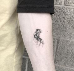 a person with a tattoo on their arm