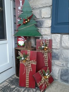 christmas presents are stacked up in front of a house