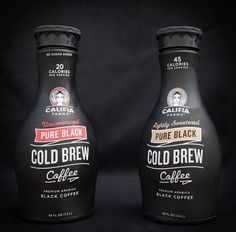 two bottles of cold brew coffee sitting side by side on a black background, one is full and the other half empty