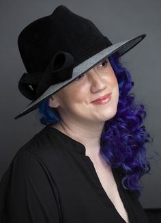 Lush black velour fur felt, paired with vintage micro, hound's-tooth, wool suiting. Trimmed in a sleek fur felt hatband and bow. Classic down-brim in a 3" width. Fully lined in cotton for breathable comfort. Contact for quotes on sizes not listed. Lifted Millinery headwear is constructed with time honored techniques and fine craftsmanship. All hats are meticulously blocked and sewn by hand, without the use of adhesives to attach trims. This ensures a long lasting hat, with the ability to be retr Formal Wool Felt Hat For Winter, Curved Brim Felt Hat For Derby And Winter, Wide Brim Hats For Winter Derby, Wide Brim Winter Derby Hats, Winter Derby Felt Hat With Curved Brim, Black Fitted Top Hat For Formal Occasions, Fitted Black Top Hat For Formal Occasions, Formal Black Winter Top Hat, Formal Black Fitted Top Hat