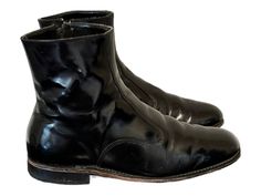 Size 10EEE Vintage short black genuine leather men flat zip up ankle dress boots. These great boots were made in the 1980s. Commonly known as Beatles boots. They are 100% leather upper and soles.  Size 10EEE height: 8" length: 12.25" insole: 11.5" width: 4.35" heel: 1" Material: leather Color: black Condition: Good Vintage There is some clear wear across the top of boots please see pictures. (please see measurements all items returned because of non fit will be subject to a $35.00 restock fee). Beatle Boots, Black Boots Men, Ankle Dress, Vintage Boots, Us Man, Vintage Shorts, Mens Shoes Boots, Dress With Boots, Vintage Men