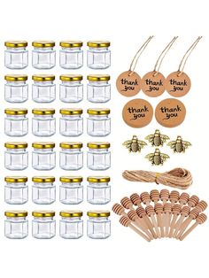 a bunch of jars with wooden tags and some other items in them on a white background