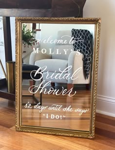 a gold framed mirror that says, welcome to moly's bridal hours