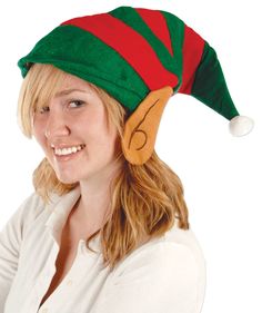 a woman wearing a green and red elf hat