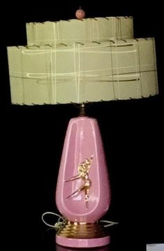 a pink lamp sitting on top of a table