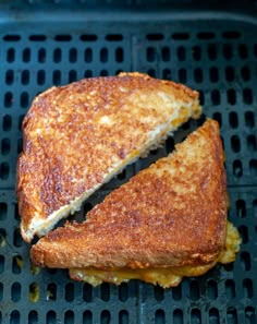 grilled cheese sandwich sitting on top of a grill