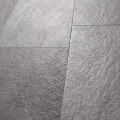 a black and white photo of a tile floor