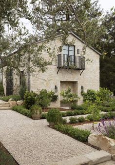 an image of a house with landscaping in the front yard