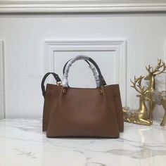 SHOP MORE LUXURY PRODUCTS HERE Description Valentino Small Vlogo Escape Brown, For Women, Women’s Bags 16.1in/41cm Size: 41 x 25 x 18 cm /16.1 x 9.8 x 7.1 inches (Width x Height x Length) Made of textured with VLOGO plaqueAdjustable and removable shoulder strapTwo handlesFront detail with magnetic closureFinish hardwareNon-removable front detail Includes dust bag.This product is of the premium quality. Dior Shirt, Gucci Shirt, Chanel Shirt, Louis Vuitton Shirt, Gucci Gg Marmont, Reversible Belt, Loafer Mules, Black Belt, Belts For Women