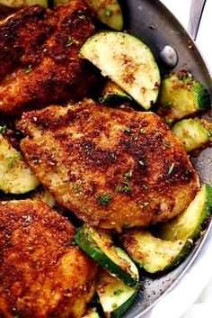 chicken and zucchini in a pan with seasoning