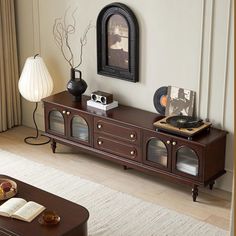 a living room with an entertainment center and coffee table