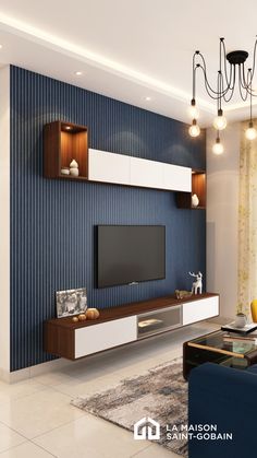 a living room with blue walls and white furniture in the center, along with a chandelier hanging from the ceiling