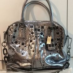 Authentic Pewter Coach Bag With Amazing Hardware And Studs. Used Very Gently. Some Wear Signs On Bottom Corners, See Pics. One Of The Handles Has Some Wear Too. Studded Bag, Bags Coach, Coach Bag, Coach Swagger Bag, Coach Bags, Crossbody Bags, Black Silver, Top Handle Bag, Handles