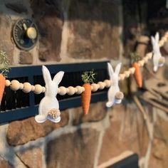 some carrots are hanging on a string with bunnies in the shape of rabbits