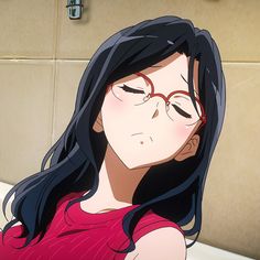 a woman with long black hair and glasses sitting on a bathtub in a bathroom