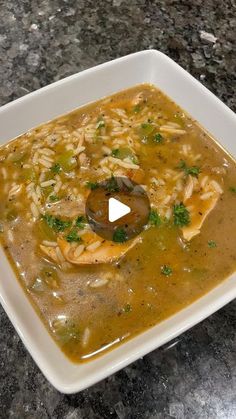 a white bowl filled with soup on top of a table