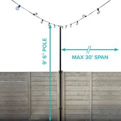 a pole with lights attached to it and measurements for the poles in front of it