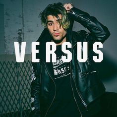 a young man wearing a leather jacket and black t - shirt with the words versus on it