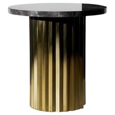 a round table with gold and black stripes on it