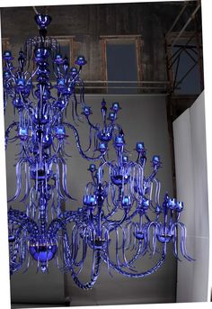 a large blue chandelier hanging from the ceiling