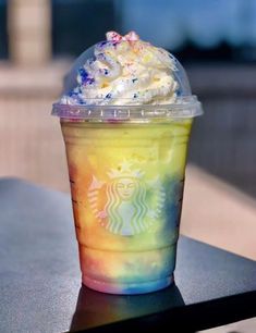 a drink with whipped cream and sprinkles on it