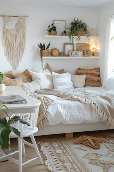 a white bedroom with lots of plants on the wall and shelves above it, along with a bed