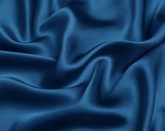 "The item is satin fabric(silk satin, silk stretch satin) of NO.75 silver lake blue color. If you are a professional buyer, please buy our fabric color card directly, so that the color difference between the photo color and the fabric color can be minimized. ●90 Colors Card. https://etsy.me/2OsRK8N ●Silk Fabric Sample. https://etsy.me/2KlMDXG WE COMBINE SHIPPING - Please Contact Us For Custom Order For silk satin we have 16mm, 19mm and 30mm: ●16mm thickness is the preferred fabric for pajamas, s Luxury Blue Art Silk Sets, Silk Fabric Blue, Crepe Fabric Blue, Satin Colors Fabric, Silk Colors Fabrics, Silk Fabric Texture, Satin Fabric Texture, Blue Silk Fabric, Blue Fabric Texture