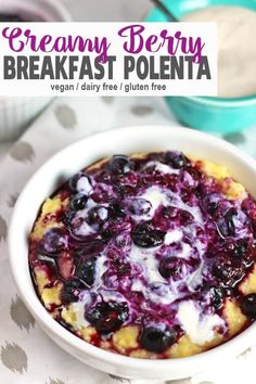 a white bowl filled with blueberry breakfast polenta on top of a tablecloth