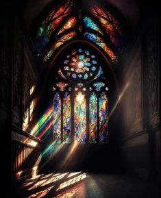 the sunlight is shining through stained glass windows