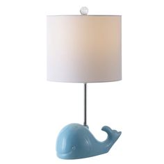 a blue whale lamp with a white shade