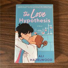 the love hypothhes by ali hazelwood is on display at the library