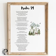 a framed poem with mountains and trees in the background, on a white wall above a wooden frame