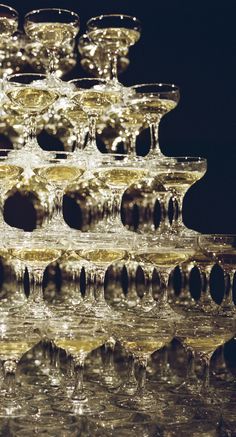 several champagne glasses stacked on top of each other