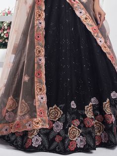 Step into elegance and grace with this stunning black color net lehenga embellished with intricate multi-embroidered work and delicate sequin detailing. The richness of the embroidery adds a regal touch, making it perfect for grand occasions like weddings, receptions, or formal gatherings. The semi-stitched lehenga offers versatility, accommodating up to 42 inches, ensuring a comfortable and flattering fit for various body types.
Complementing the lehenga is a net choli in a similar black hue, a Engagement Gown, Lehenga Crop Top, Lehenga Choli Wedding, Floral Lehenga, Stitched Lehenga, Party Wear Lehenga Choli, Reception Gown, Weddings Receptions, Bollywood Lehenga