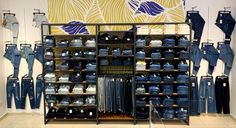 a clothing store with lots of blue jeans on display