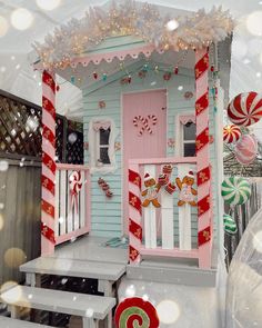 a doll house with candy canes and decorations