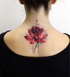 a woman with a tattoo on her back neck