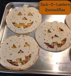 four tortillas with jack - o'- lantern faces on them sitting in a pan