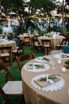 a table set up with place settings and candles