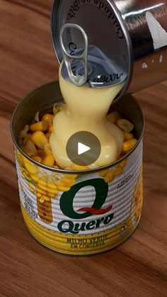 a can of corn being poured into it