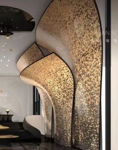 an artisticly designed lobby with black and gold accents