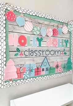 a wooden sign that says holiday classroom hanging on the wall next to a white bench