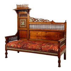 an old wooden bench with ornate carvings on the top and bottom, sitting against a white background