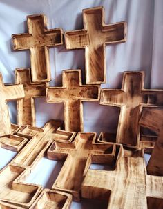 a group of wooden crosses sitting on top of a table