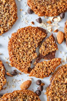 several cookies with nuts and chocolate on top