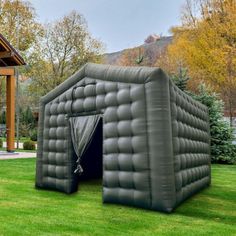 an inflatable tent is set up on the lawn