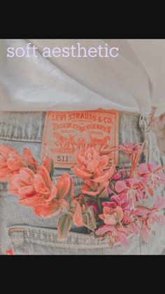 the back pocket of a pair of jeans with flowers on it and a label that says levi strauss & co